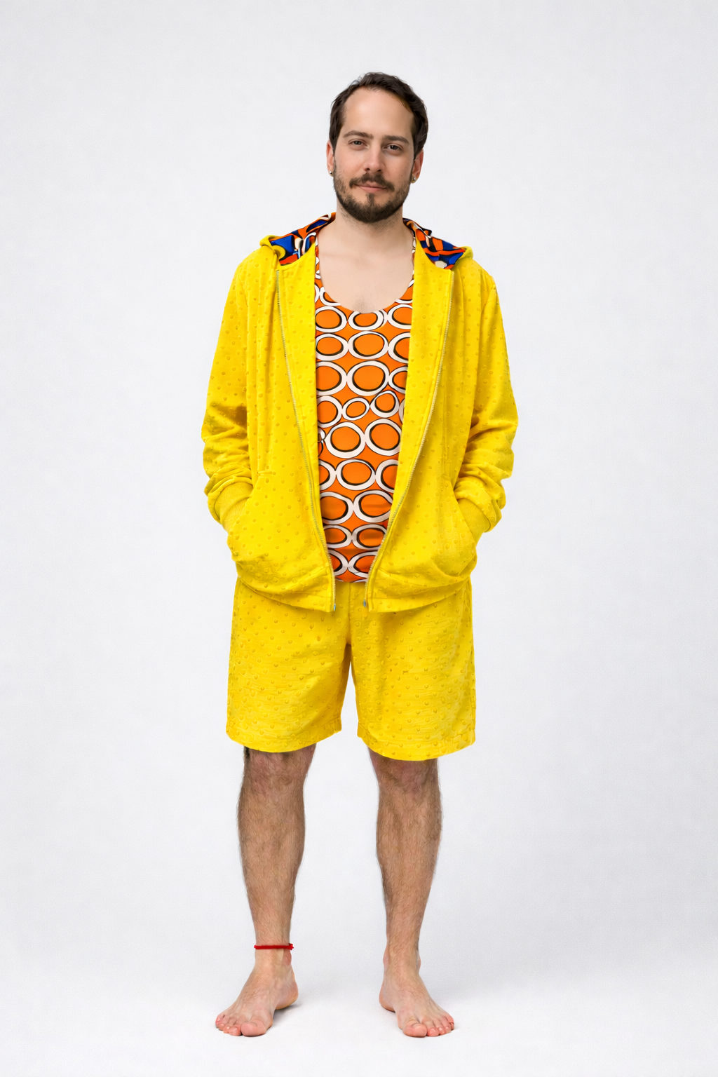Conjunto Corta-Vento com Capuz + Bermuda Reta + Regata Mullet Estampada